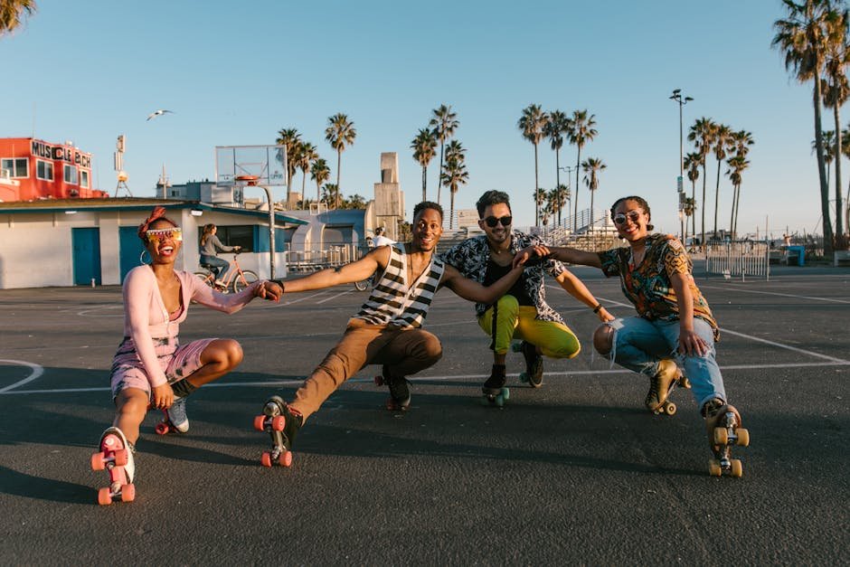 Group of friends enjoying roller skating outdoors in sunny California with palm trees and vibrant attire.